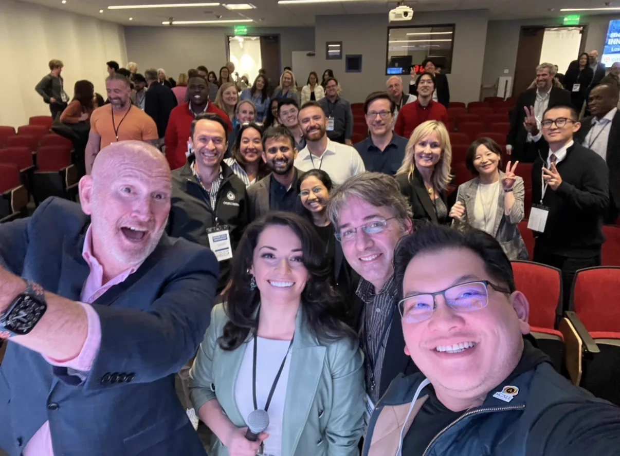 Group photo with attendees and speakers after an innovation summit session
