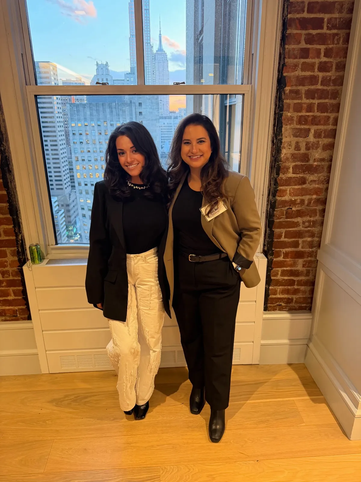 Natalyia with AI expert Allie K. Miller at an evening event overlooking the Manhattan skyline