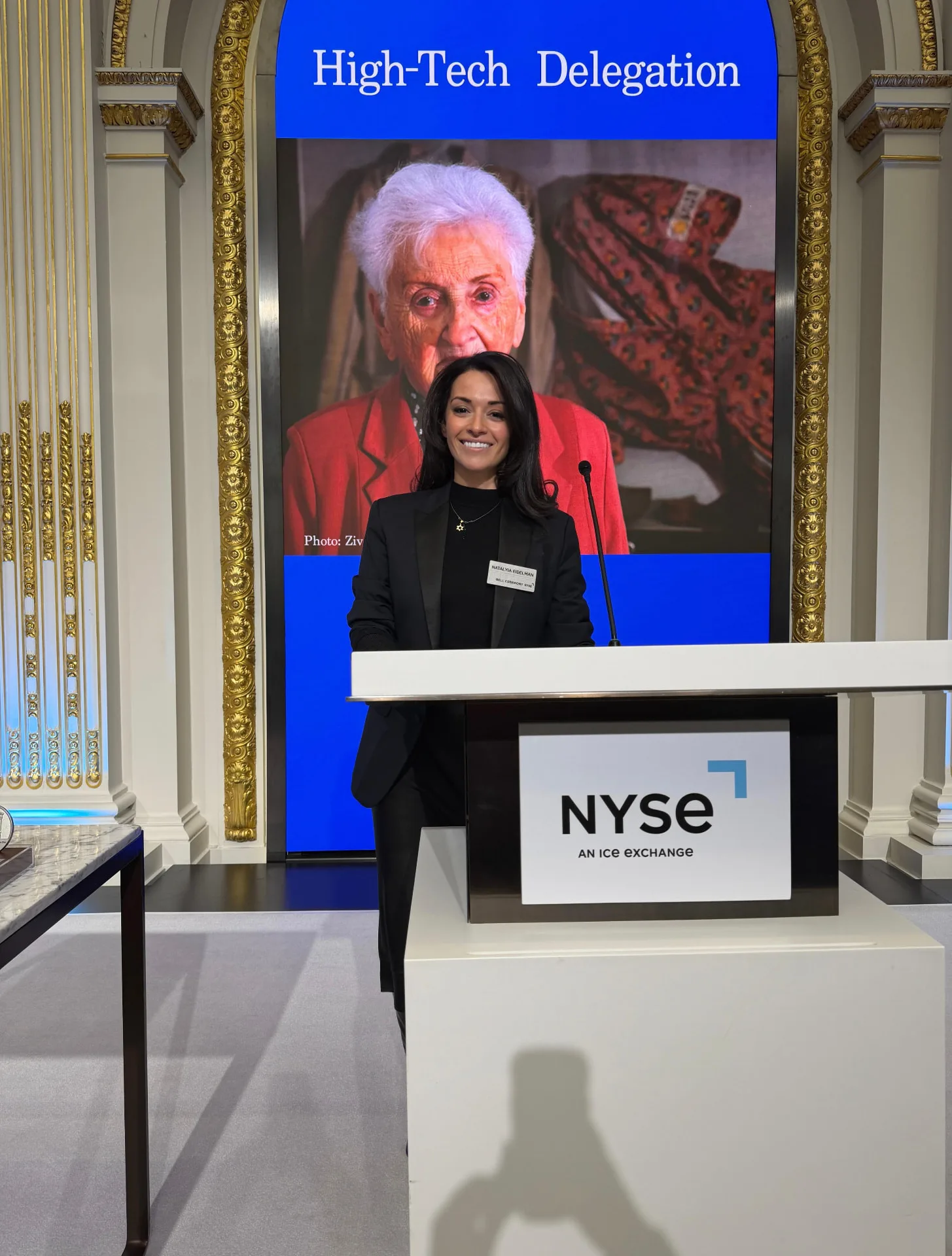 Natalyia speaking at the podium during the High-Tech Delegation bell ceremony at the NYSE